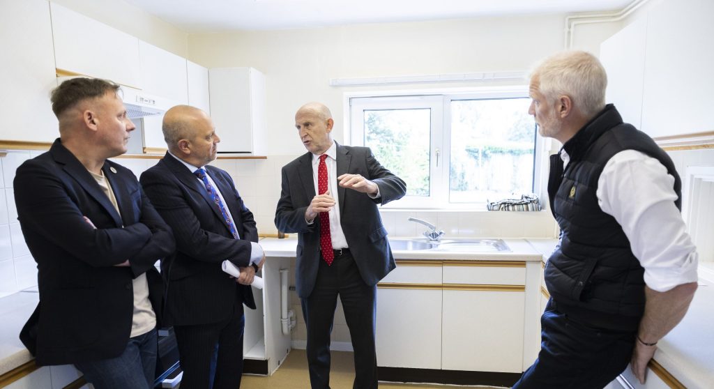 The Secretary of State for Defence John Healey (centre) and Minister for Veterans and People Alistair Carns (right), where they were shown newly refurbished military accommodation by the Director of Accommodation Phil Riley (centre left) and President of the Royal British Legion's (RBL) St. James's Branch Antony Cotton (left).